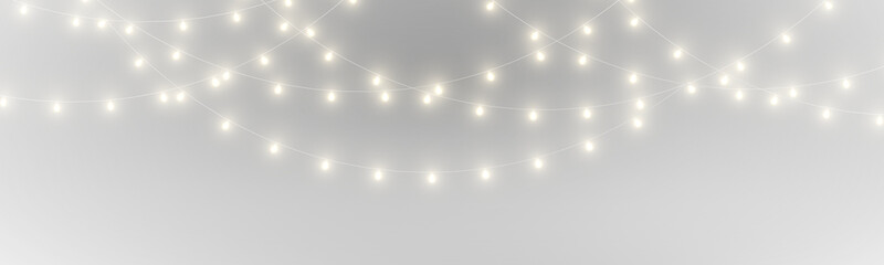 Obraz premium PNG. Golden Christmas lights string with sparkling glow. Elegant decoration for luxury holiday themes. Works well for posters and cards.