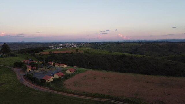 Aerial view of the iconic mountains of Serra da Canastra at sunset, featuring golden-hour light, rolling highlands, dramatic landscapes, vast horizons, and the natural beauty of rural Brazil.