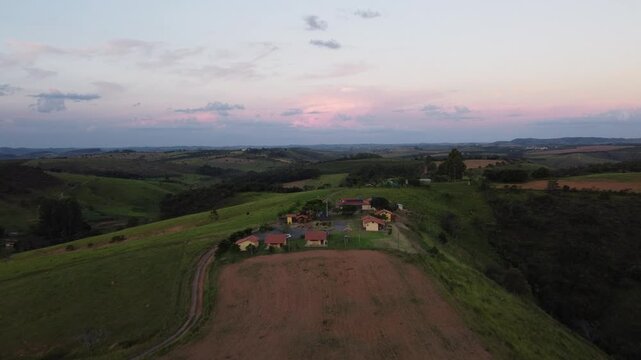 Aerial view of the iconic mountains of Serra da Canastra at sunset, featuring golden-hour light, rolling highlands, dramatic landscapes, vast horizons, and the natural beauty of rural Brazil.