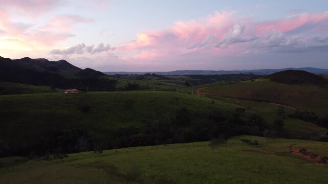 Aerial view of the iconic mountains of Serra da Canastra at sunset, featuring golden-hour light, rolling highlands, dramatic landscapes, vast horizons, and the natural beauty of rural Brazil.