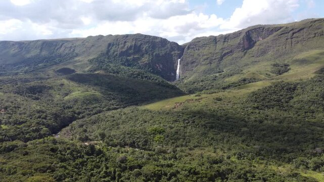 Aerial views of Casca D&rsquo;Anta Waterfall in Serra da Canastra National Park, Brazil, featuring towering cliffs, cascading water, rugged landscapes, and the pristine beauty of one of Brazil&rsquo;s most iconic