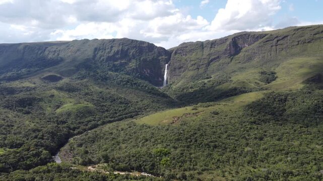 Aerial views of Casca D&rsquo;Anta Waterfall in Serra da Canastra National Park, Brazil, featuring towering cliffs, cascading water, rugged landscapes, and the pristine beauty of one of Brazil&rsquo;s most iconic