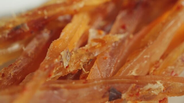Dried fish fillet is the perfect beer snack. Salty and aromatic, perfect for friendly get-togethers or a relaxing evening. High quality 4k footage