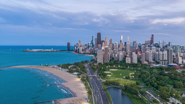 Chicago downtown skyline hyperlapse showing sunset transition over Lincoln Park, Lake Shore Drive and Lake Michigan with John Hancock Center and Willis Tower