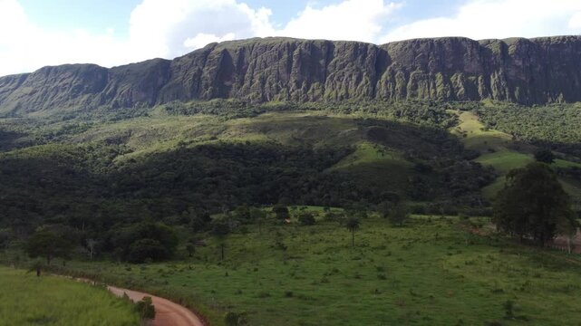Aerial views of the towering cliffs and escarpments of Serra da Canastra, Brazil, showcasing dramatic rock formations, vast plateaus, rugged landscapes, and the untouched beauty of the Brazilian highl