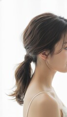 Obraz premium Woman with ponytail in profile view