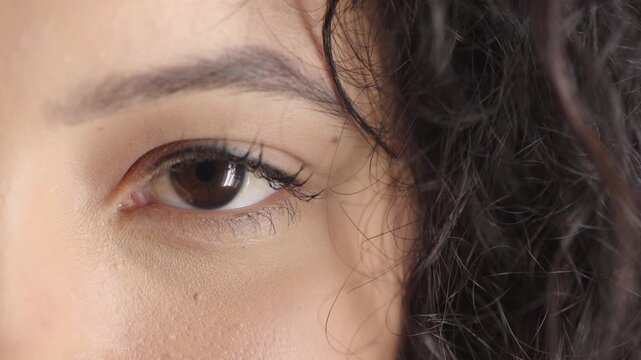 Blink, eye and sight with girl closeup for optometry appointment or vision correction. Exam, eyecare and test with patient at ophthalmology checkup for visual development, enhancement or improvement