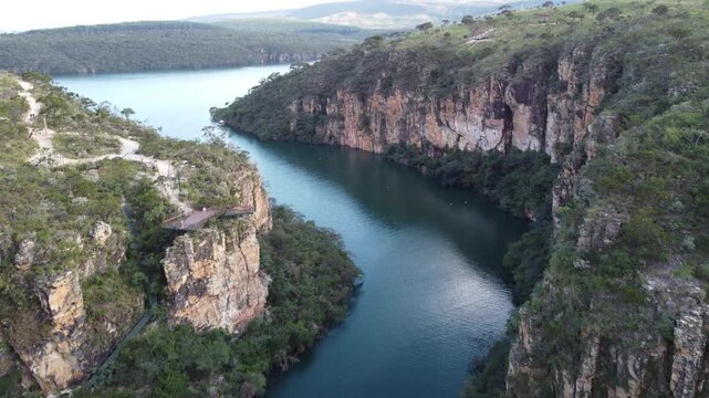 Aerial views of the Capit&oacute;lio Canyons in Minas Gerais, Brazil, showcasing dramatic rock cliffs, emerald waters of Furnas Lake, breathtaking landscapes, and one of the country's most iconic natural att