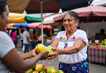 Fototapeta premium Mexican Fruit Vendor Serving African Customer at Outdoor Market