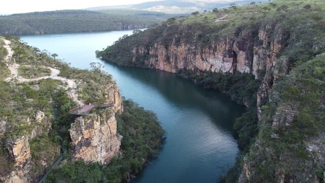 Aerial views of the Capit&oacute;lio Canyons in Minas Gerais, Brazil, showcasing dramatic rock cliffs, emerald waters of Furnas Lake, breathtaking landscapes, and one of the country's most iconic natural att