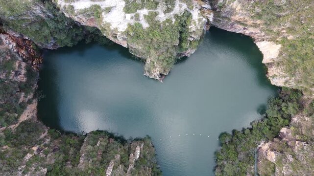 Aerial views of the Capit&oacute;lio Canyons in Minas Gerais, Brazil, showcasing dramatic rock cliffs, emerald waters of Furnas Lake, breathtaking landscapes, and one of the country's most iconic natural att