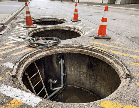 Open Manhole on Street with Safety Cones