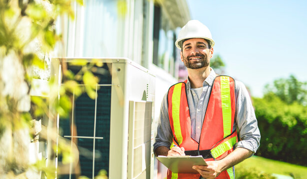technician working on air conditioning or heat pump outdoor unit inspection or repair