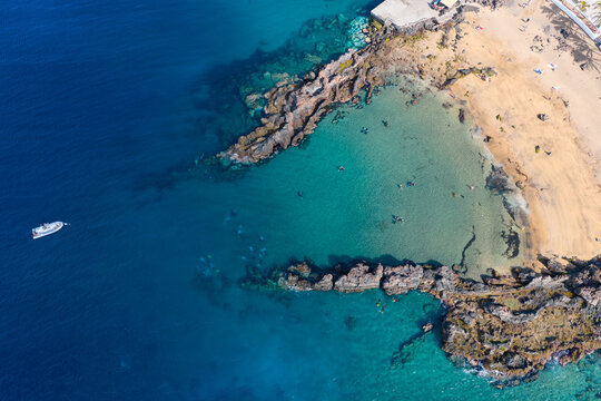 Aerial Drone View of Scuba Divers Training in Crystal Clear Coastal Waters of Puerto del Carmen Lanzarote