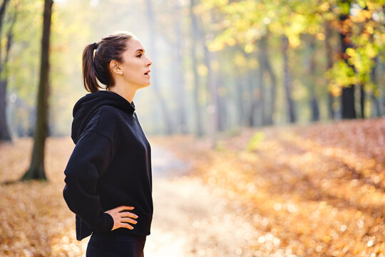 Young woman during break in autumn forest