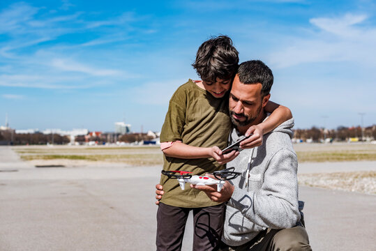 Father and son with drone