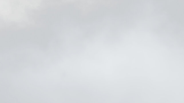 Cloudy sky with gray tones in an isolated view during midday offering a simple and clear appearance without any distinct features, PNG with a light overlay