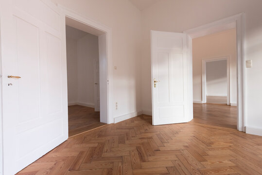 Spacious empty flat with herringbone parquet