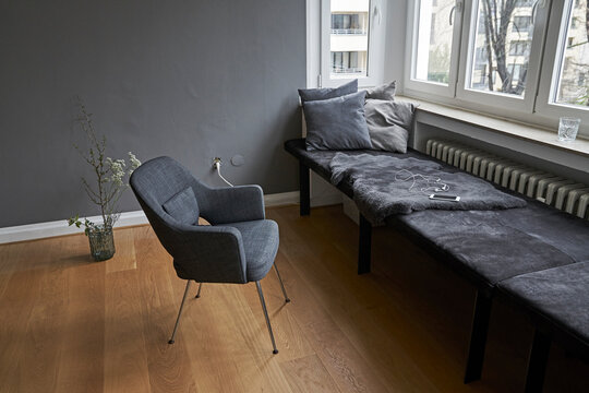 Interior with bench and chair at window