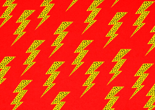 Yellow pop art lightning bolt pattern on red background