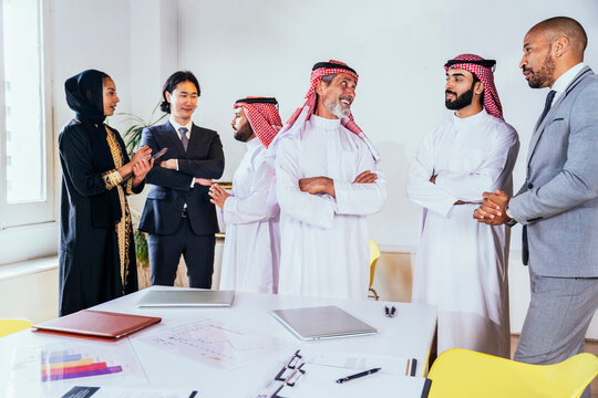 Diverse international business team meeting in a modern office