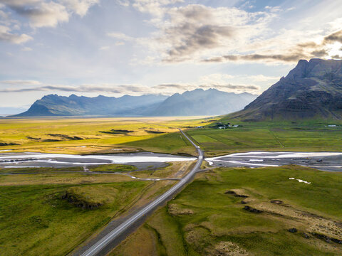 Aerial view of Route 1 highway through green plains in H�fn Iceland