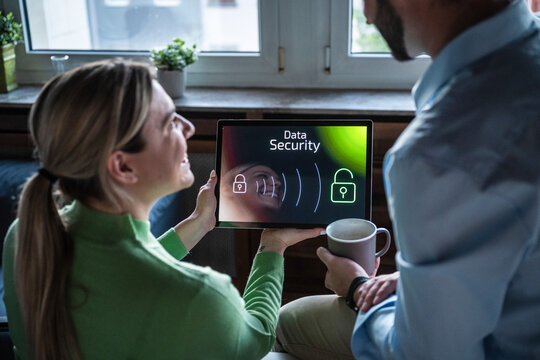 Colleagues reviewing data security on a tablet in the office