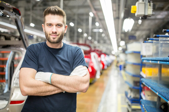 Portrait of confident worker in modern car factory