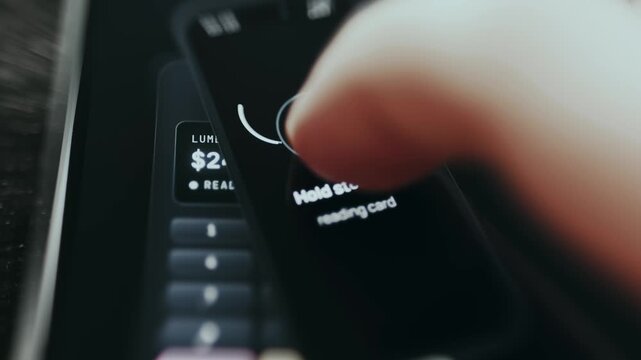NFC payment interface displaying hold phone near terminal prompt