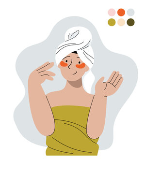 Happy woman with towel on head after shower wrapped in bath towel