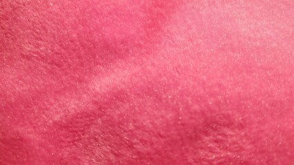 Close-up of soft pink fleece fabric texture background © Putu