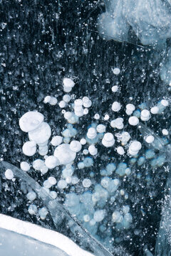 Gas methane bubbles frozen in blue ice of lake Baikal
