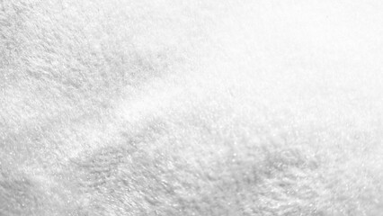 White soft fur texture background. Close up luxury fleece or plush fabric material. © Putu