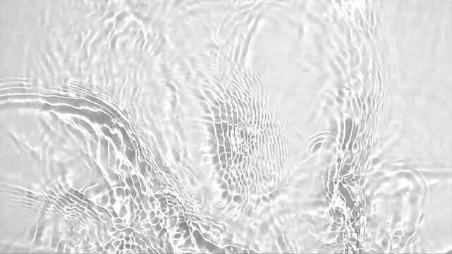 Pure beige water with reflections sunlight in slow motion. Water surface texture top view. Sun and shadows. Motion clean swimming pool ripples and wave.