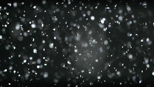 snowflake falling on dark background