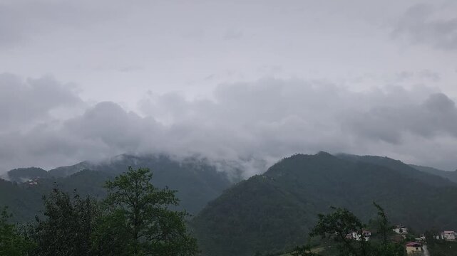 A powerful June storm sweeps across the mountains of the Black Sea Region, with dark clouds, dramatic skies, and fading evening light creating a striking landscape.