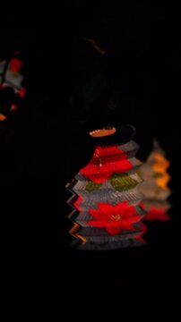 vertical video of vesak lanterns glowing at night during buddhist festival