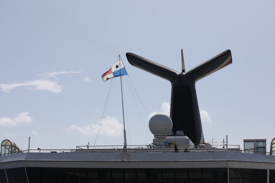 Iconic Whale Tail Funnel of a Cruise Ship with Panama Flag Flying on Top Deck