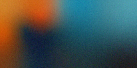 Obraz premium Abstract grainy gradient background with soft transition from warm orange to cool blue tones