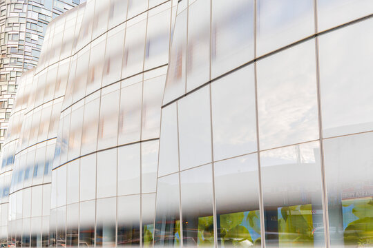 Modern glass architecture with reflective surfaces provides a sleek urban background for travel and business concepts, IAC Building, Chelsea, Manhattan, New York City, United States, USA.