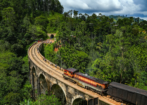 Image of the train running along the Nine Arches Bridge located in valley Demodara, Ella, Sri Lanka, Asia	