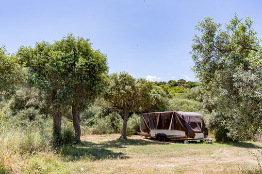 Small rv parked in the middle of a field, Ammoulliani, Greece
