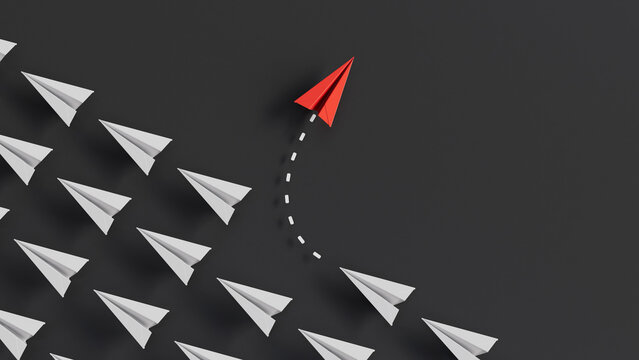 Red Paper Airplane Changing Direction and Breaking Away From the Crowd of White Planes.