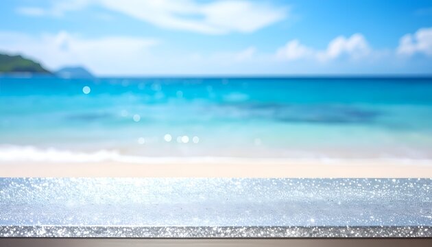 Shimmering tabletop with blurred ocean and blue sky background