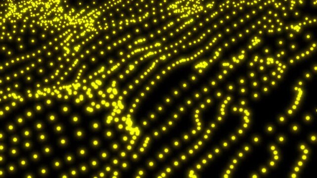 Abstract yellow dots forming a random pattern on black background