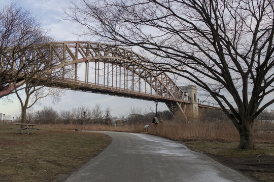 rail bridge in new york city linking randalls island with astoria queens public park cycle and pedestrian way bike path arches industrial space underneath viaduct railroad long island city tourism usa