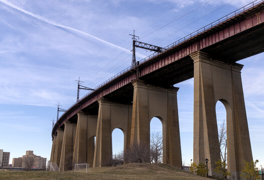 rail bridge in new york city linking randalls island with astoria queens public park cycle and pedestrian way bike path arches industrial space underneath viaduct railroad long island city tourism usa