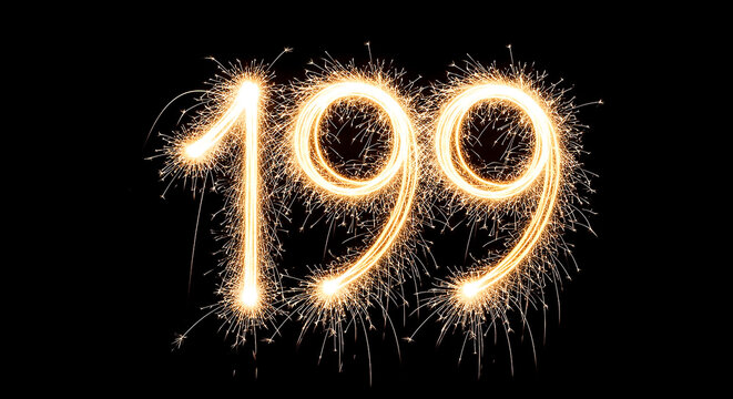 Golden sparklers arranged in the shape of the year 1999, creating a festive and nostalgic visual against a dark background, ideal for celebrations or retro-themed projects.