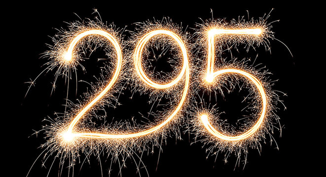 Vibrant sparkler fireworks forming the number 295 against a dark night sky background, creating a celebratory visual effect.