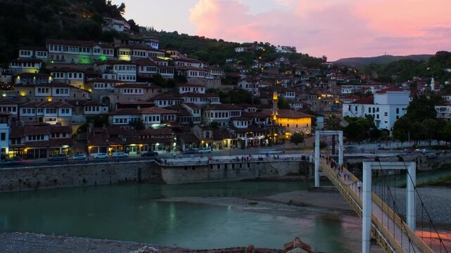 Time lapse of Berat, Albania during a sunset. It goes from the late evening to night with illumination being turned on, panning video